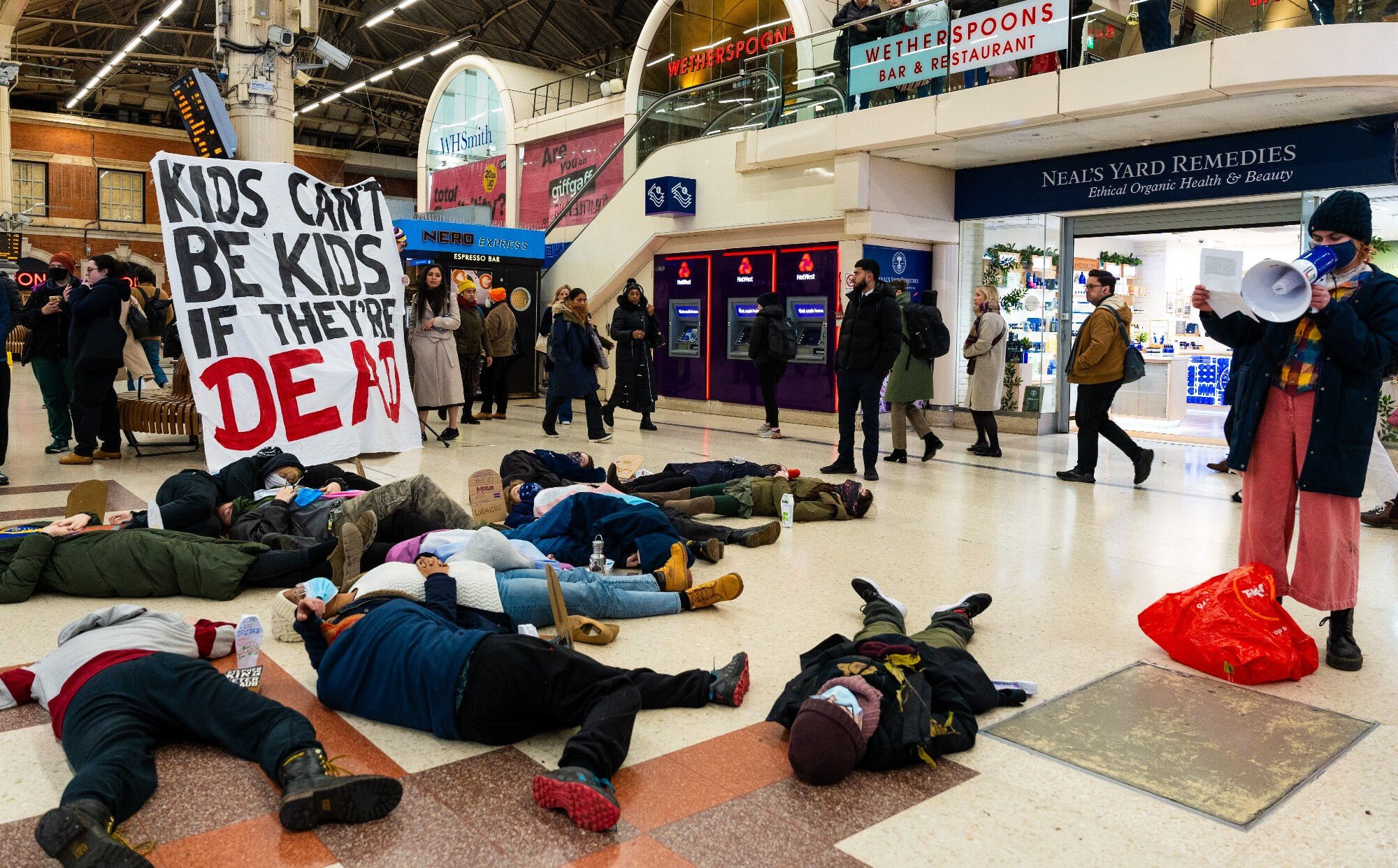 Trans Kids Deserve Better group holds "die-in" protest at London's Victoria Station