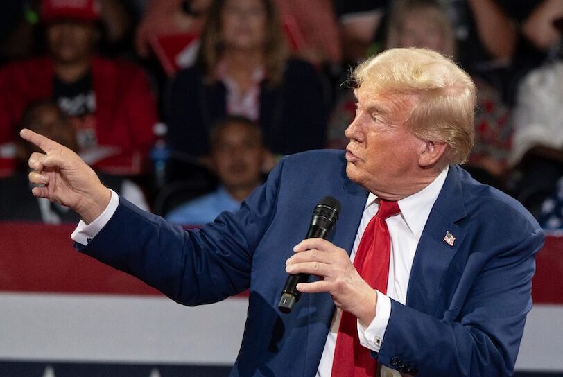 Former president Donald Trump talks about the assassination attempt on him as he speaks to an audience during a town hall meeting at Dort Financial Center in Flint, Michigan on Tuesday, September 17, 2024.