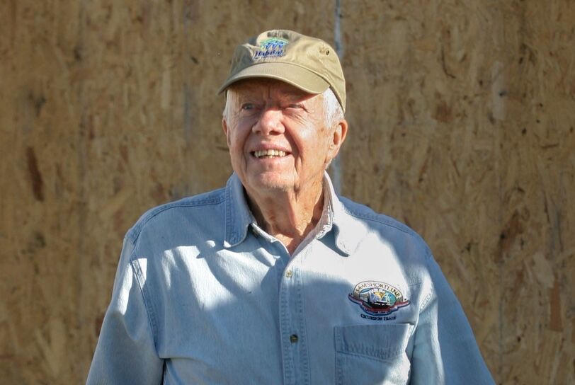 Pres. Jimmy Carter takes a look at the progress of the house that he is helping to build during Habitat for Humanity International's 2005 Jimmy and Rosalynn Carter Work Project in Benton Harbor, Michigan.