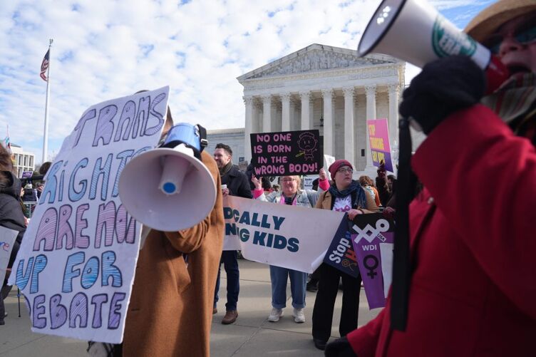 Protesters demonstrate outside the U.S. Supreme Court in Washington, D.C. on Dec. 4, 2024.