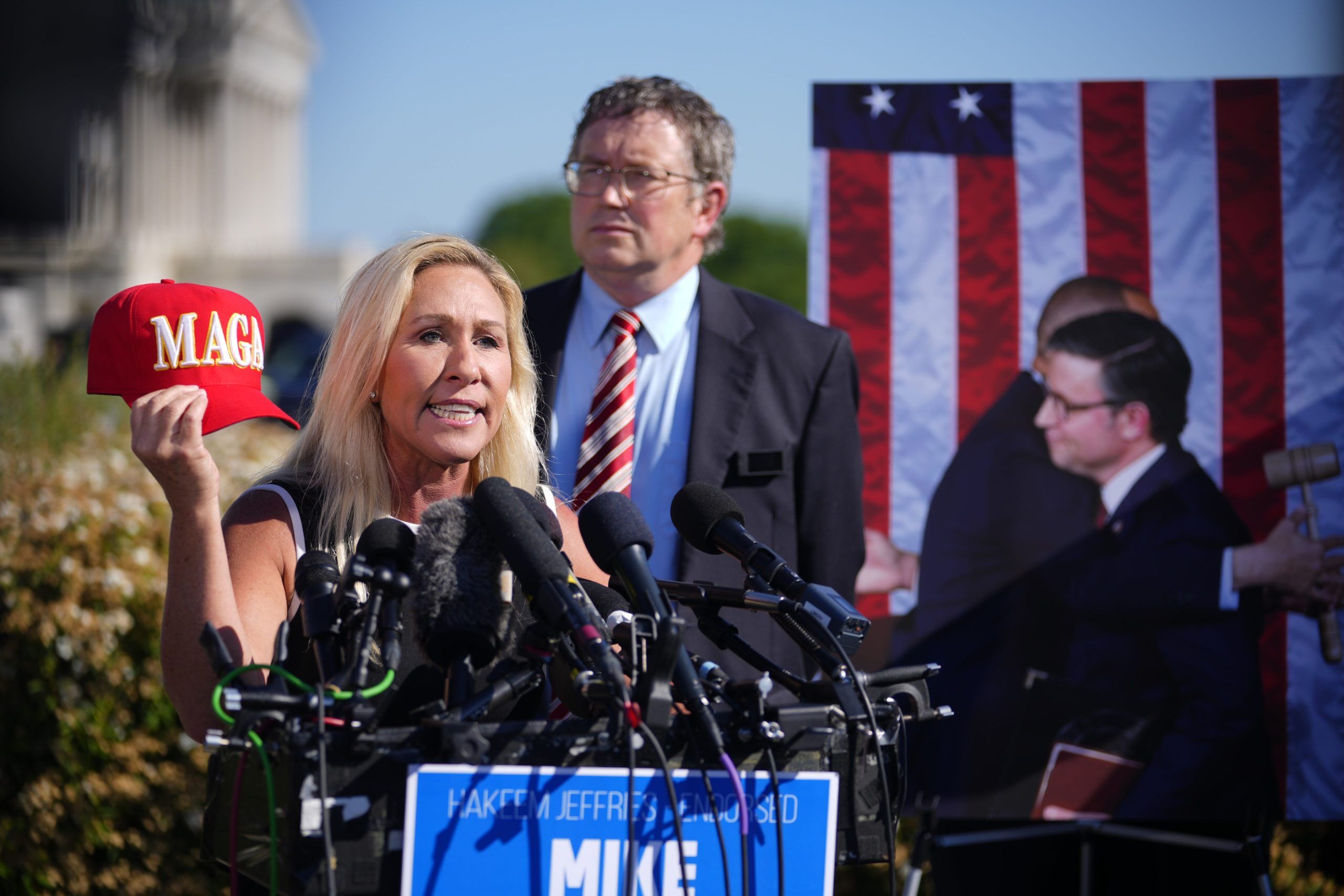 Republican Reps. Marjorie Taylor Greene of Georgia and Thomas Massie of Kentucky hold a news conference against House Speaker Mike Johnson on May 1, 2024.