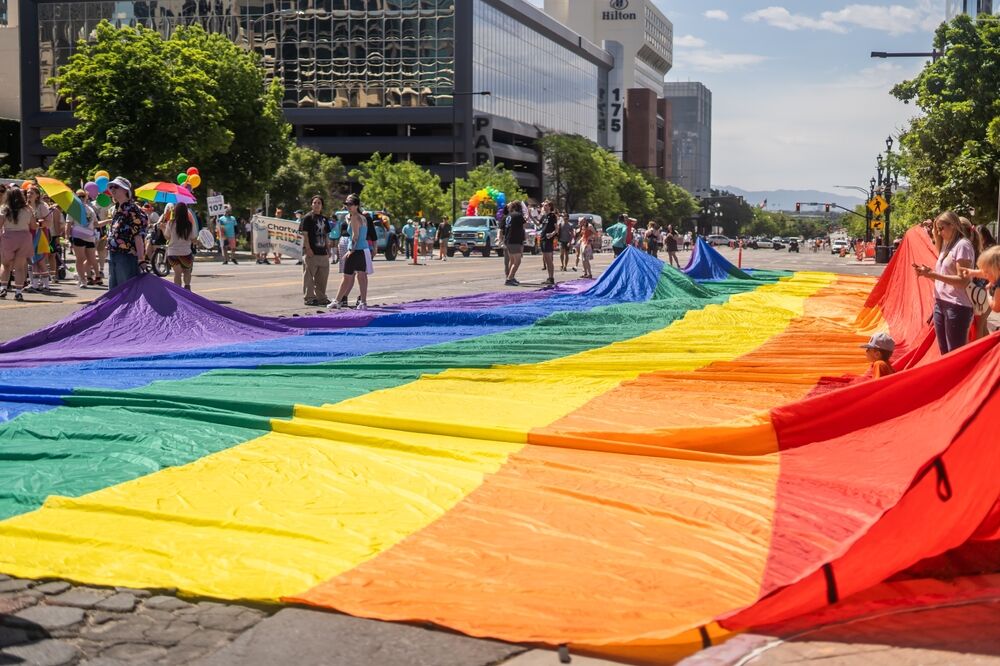 shutterstock_2476967143 Salt Lake City, Utah USA June 2nd 2024: Utah Pride Parade Giant Rainbow Flag