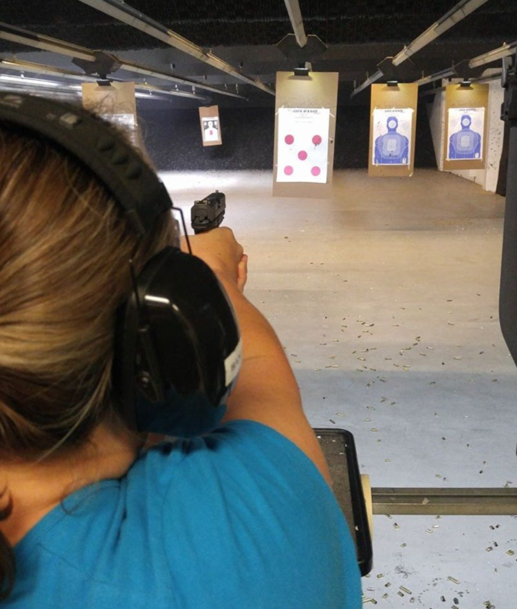 A person shooting a gun at a target