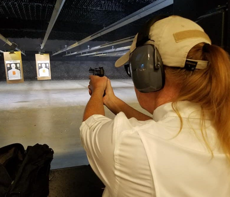 A person shooting a gun at a target