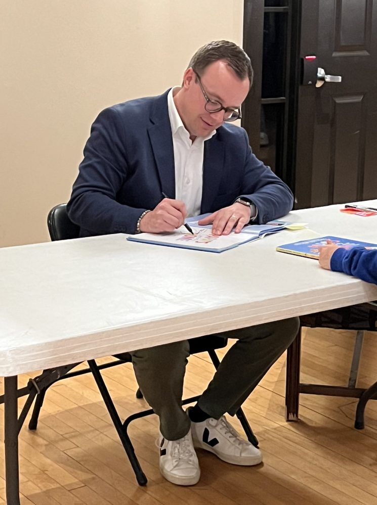 Chasten Buttigieg signs autographs in Naperville, Illinois while on tour promoting his children's book,