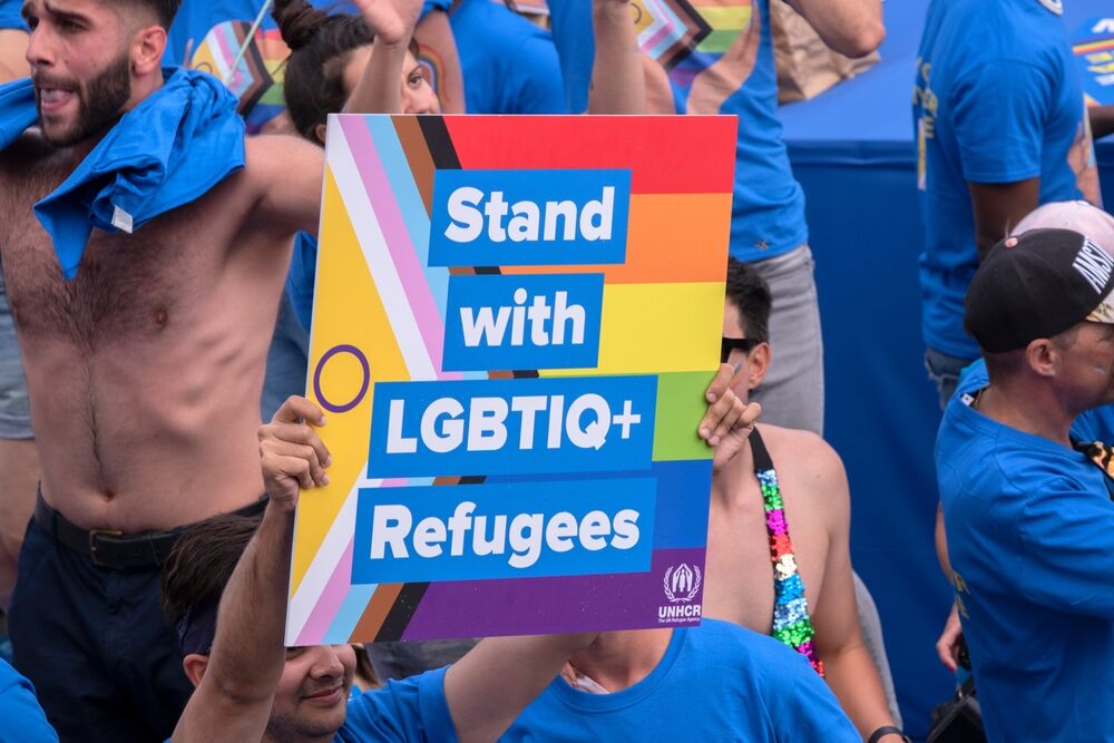 Billboard UNHCR At The Gaypride Canal Parade With Boats At Amsterdam The Netherlands 6-8-2022