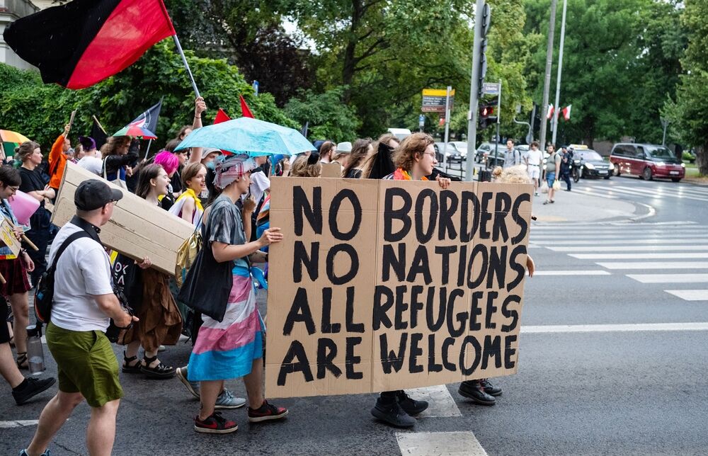 Pro-refugee demonstrators at an LGBTQ+-inclusive protest.